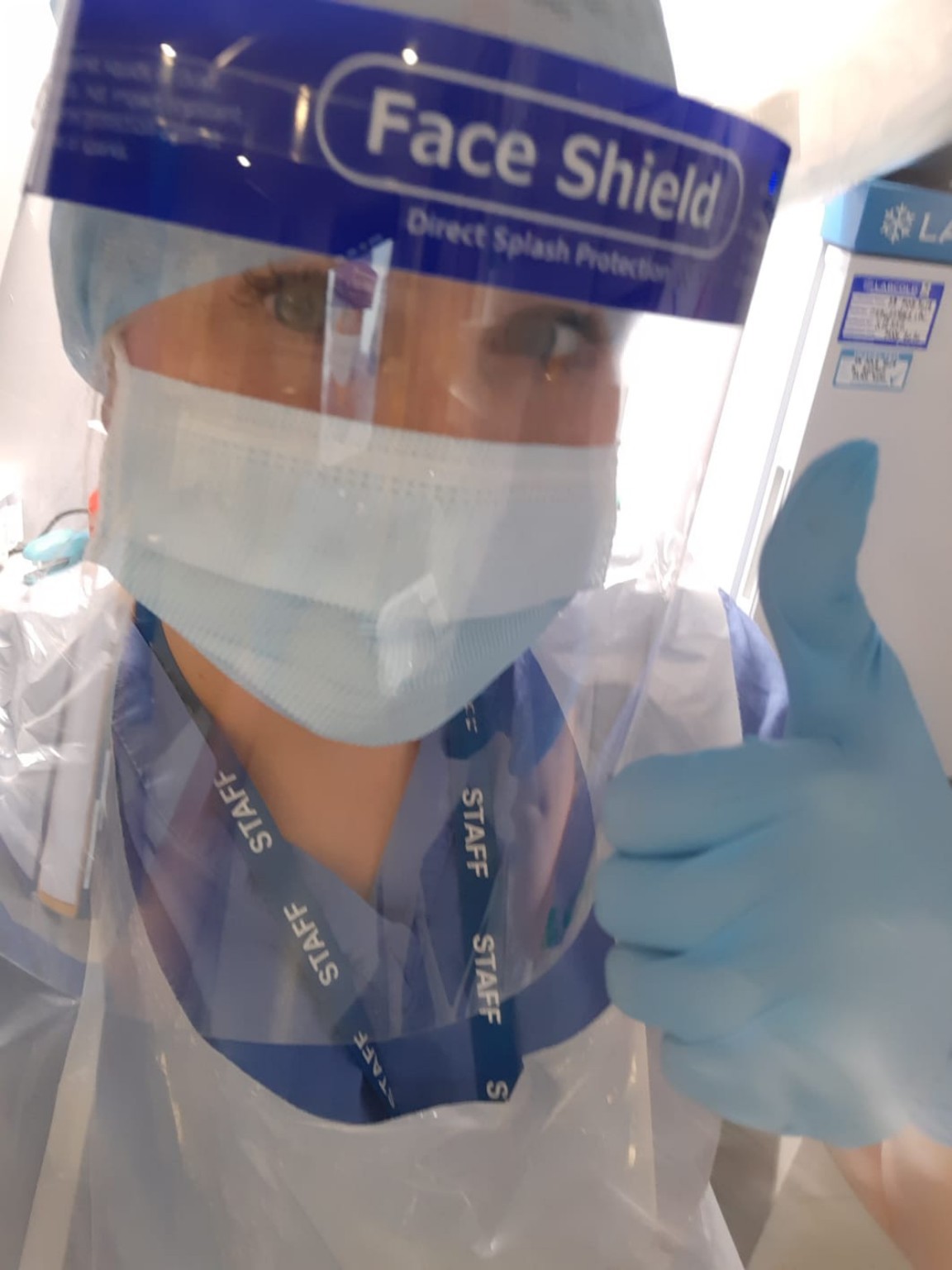 Louise working through COVID in a face shield